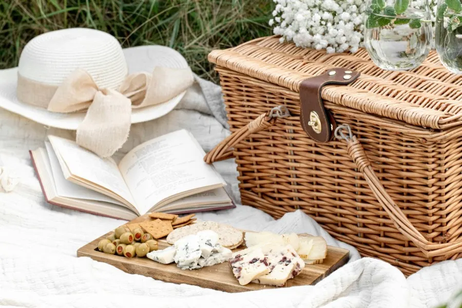 The Fellwalker hamper unpacked as a picnic with a cheese board